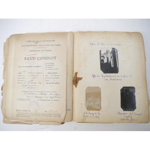 9105 - A World War 1 souvenir album containing photographs, postcards, manuscript pen & ink sketches and en... 