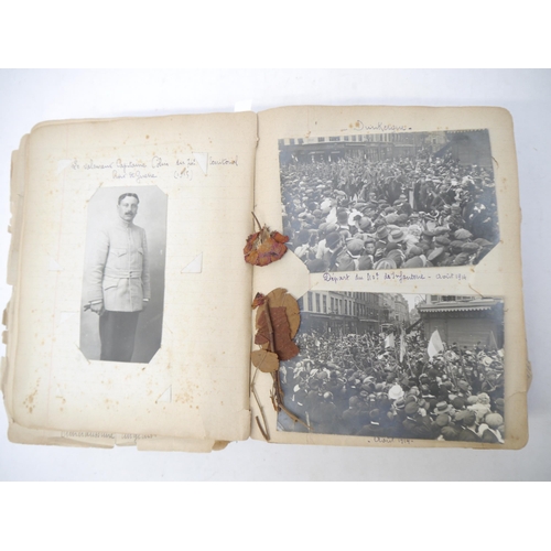 9105 - A World War 1 souvenir album containing photographs, postcards, manuscript pen & ink sketches and en... 