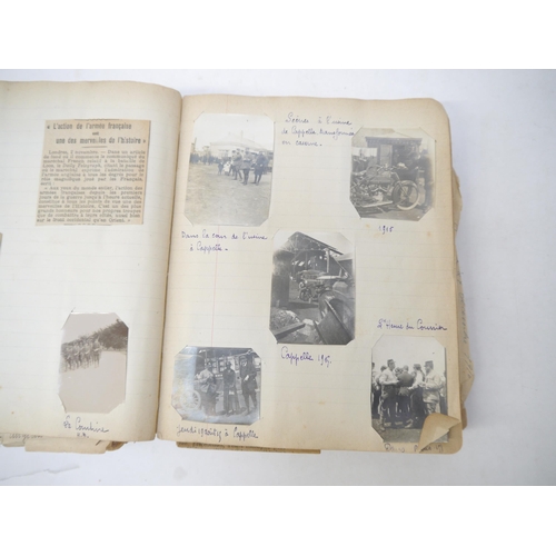 9105 - A World War 1 souvenir album containing photographs, postcards, manuscript pen & ink sketches and en... 