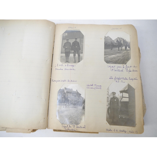 9105 - A World War 1 souvenir album containing photographs, postcards, manuscript pen & ink sketches and en... 