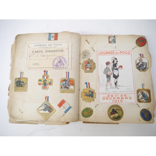 9105 - A World War 1 souvenir album containing photographs, postcards, manuscript pen & ink sketches and en... 