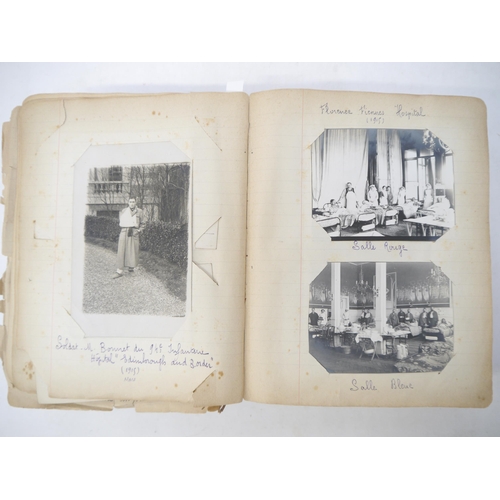 9105 - A World War 1 souvenir album containing photographs, postcards, manuscript pen & ink sketches and en... 