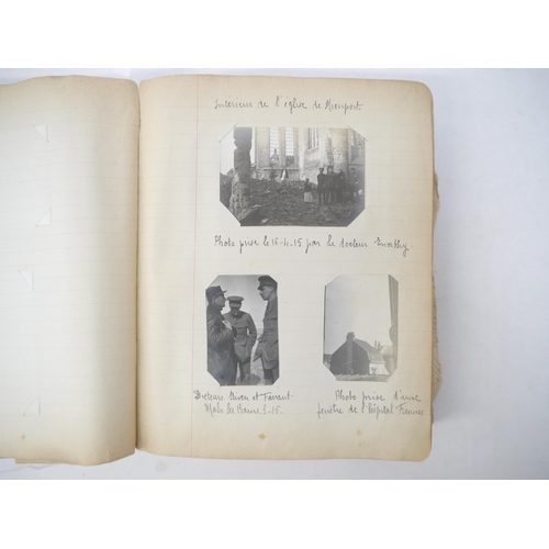 9105 - A World War 1 souvenir album containing photographs, postcards, manuscript pen & ink sketches and en... 