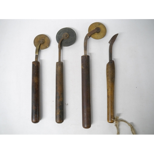 9214 - (Bookbinding). Four wooden handled brass finishing tools, including three fillet wheels. Provenance:... 