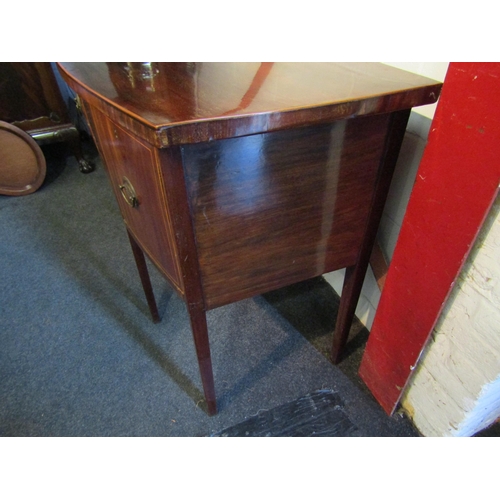 1004 - A Georgian style bow-fronted mahogany sideboard with central drawer flanked by two side drawers.  Va... 