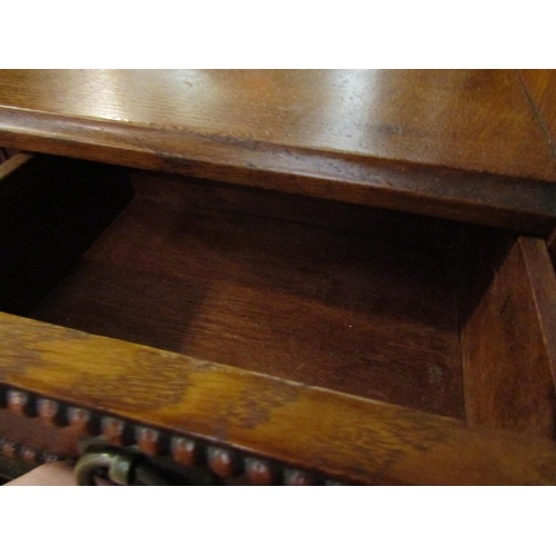 1013 - An oak hall mirror with bevel edged glass over two drawers, 93cm high x 49cm wide x 20cm deep   (R) ... 