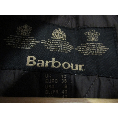 1032 - A Barbour lady's wax coat size 12