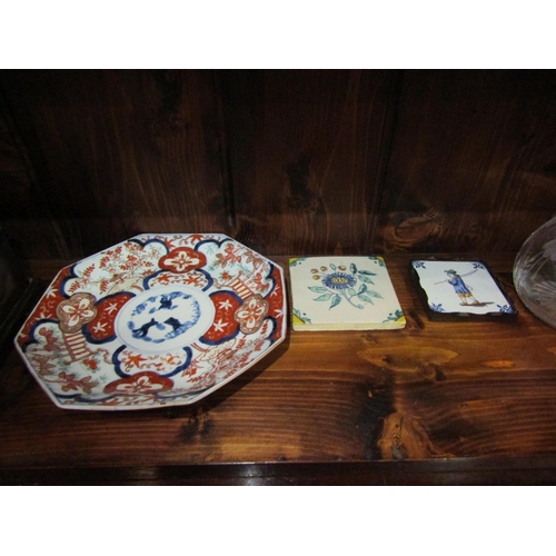 1060 - A brass counter bell, Japanese Imari plate (a/f), two small tiles, a cut glass water jug and a woode... 