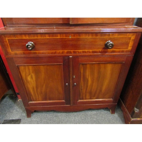 1061 - A Victorian style mahogany secretaire bookcase, the broken arch top over two astragal glazed doors t... 