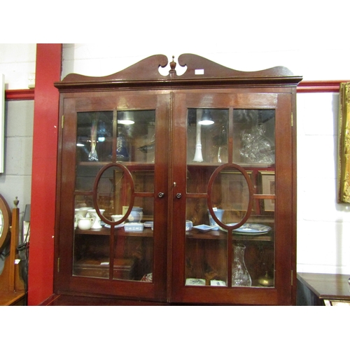 1061 - A Victorian style mahogany secretaire bookcase, the broken arch top over two astragal glazed doors t... 