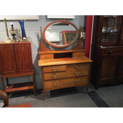 1063 - A mahogany and inlaid dressing table, two short drawers over two long drawers, 157cm high x 107cm wi... 