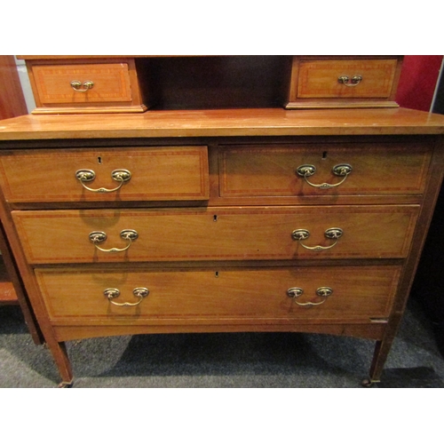 1063 - A mahogany and inlaid dressing table, two short drawers over two long drawers, 157cm high x 107cm wi... 