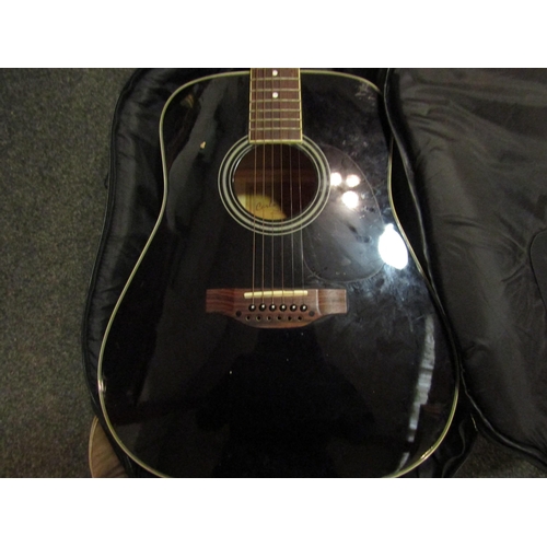 1064 - A Carlo Robelli twelve string acoustic guitar in soft case, missing some strings   (R) £45