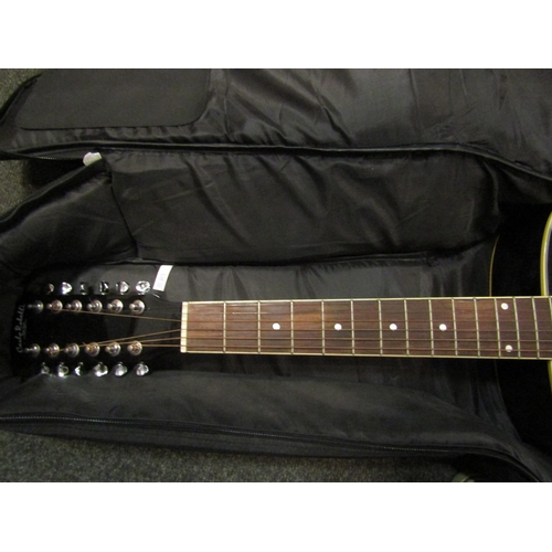 1064 - A Carlo Robelli twelve string acoustic guitar in soft case, missing some strings   (R) £45