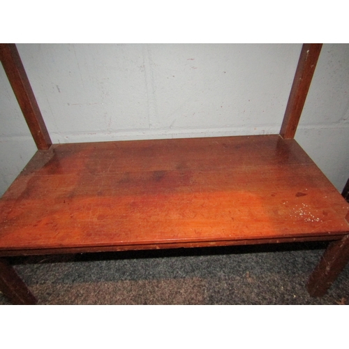 1069 - A late Victorian mahogany cabinet, the two doors opening to reveal shelf space with under-tier, on s... 