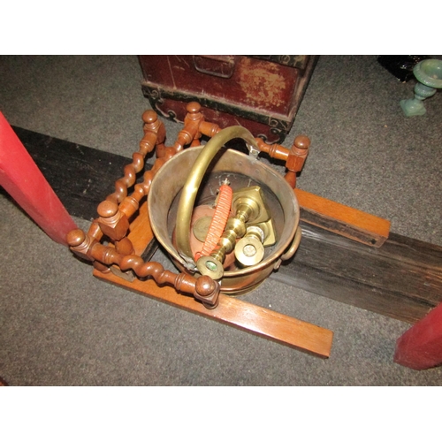 1090 - A brass coal scuttle, copper kettle, candlesticks and a fire screen