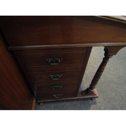 1125 - An Edwardian Davenport with gilt tooled leather insert and four drawers, 90cm high x 59cm wide x 55c... 