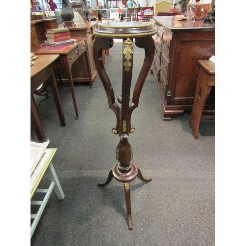 1130 - A French style mahogany jardiniere, ormolu mounts, finial and scroll column, tripod base, 99cm high