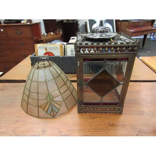 1149 - A brass and leaded glass lantern shade with modern ceiling fitting, also a brass framed shell shade ... 