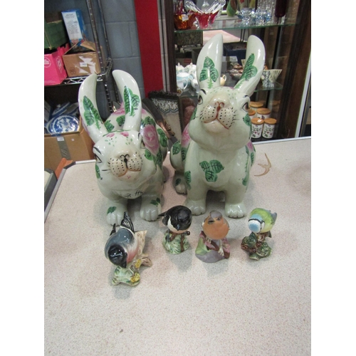 1458 - A pair of hand-painted rabbits in 