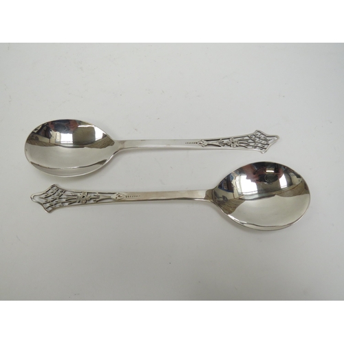 5004 - A Lee and Wigfull (Henry Wigfull) silver cased pair of Art Nouveau serving spoons, pierced handles w... 