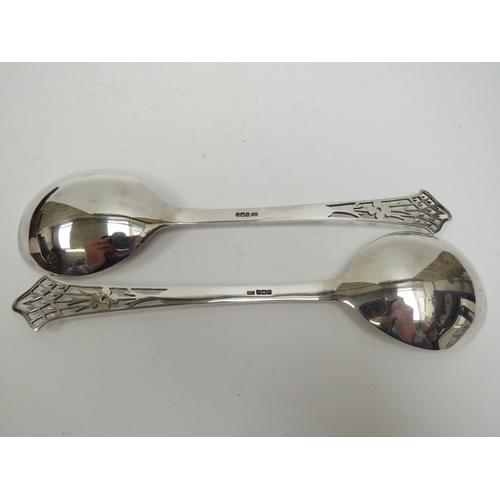 5004 - A Lee and Wigfull (Henry Wigfull) silver cased pair of Art Nouveau serving spoons, pierced handles w... 