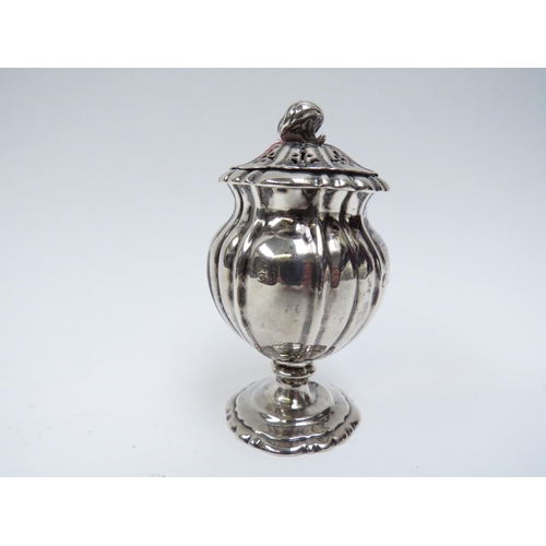5005 - A Richard Pearce & George Burrows silver pepperette of pedestal lobed form, London 1828, marks rubbe... 