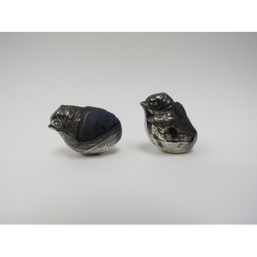 5006 - A pair of Sampson Mordan & Co Ltd. silver chick shaped pin cushions, major areas of damage including... 