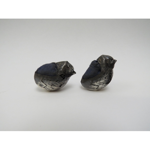 5006 - A pair of Sampson Mordan & Co Ltd. silver chick shaped pin cushions, major areas of damage including... 