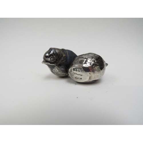 5006 - A pair of Sampson Mordan & Co Ltd. silver chick shaped pin cushions, major areas of damage including... 