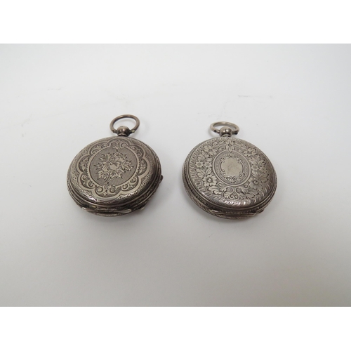 5007 - Two silver fob watches with ornately engraved cases, Chester 1882 and Birmingham 1885