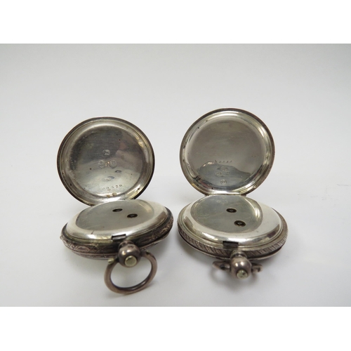 5007 - Two silver fob watches with ornately engraved cases, Chester 1882 and Birmingham 1885