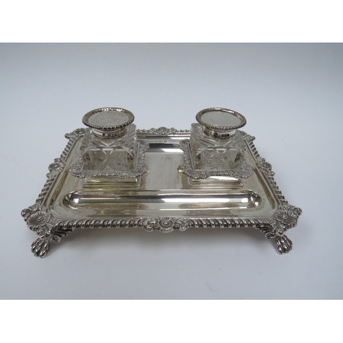 5008 - A Thomas Bradbury & Sons silver twin bottled inkstand with double pen holder, wrythen and floral bor... 