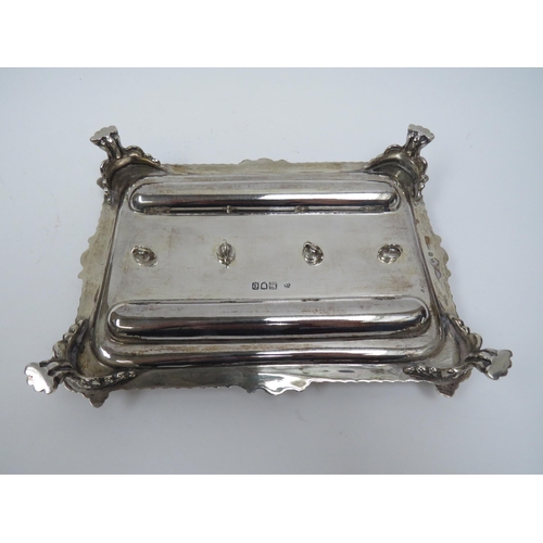 5008 - A Thomas Bradbury & Sons silver twin bottled inkstand with double pen holder, wrythen and floral bor... 