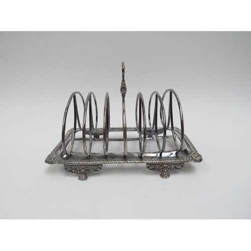 5015 - A Georgian Soloman Hougham silver seven bar toast rack, monogrammed 18.5cm long x 12.5cm tall, 429g