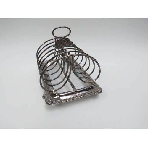 5015 - A Georgian Soloman Hougham silver seven bar toast rack, monogrammed 18.5cm long x 12.5cm tall, 429g