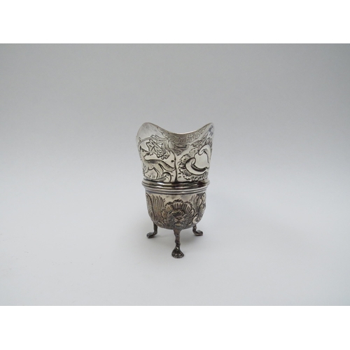 5016 - A T. Hill silver repoussé milk jug on three legs, decorated with ducks, fox, swan and dolphin, Birmi... 