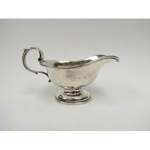 5019 - A Victorian silver cream jug with S-Scroll handle, marks rubbed, 7.5cm tall, 13.5cm long, 111g
