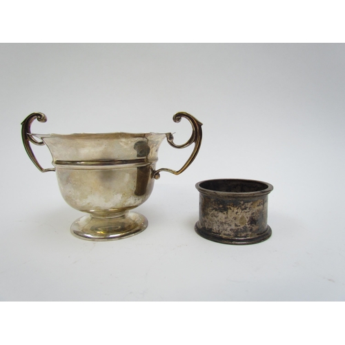 5021 - A William Hutton & Son silver twin handled sugar bowl, Birmingham 1905 and a Walker & Hall napkin ri... 