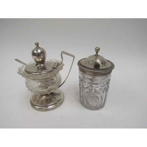 5027 - A Continental silver topped mustard with crystal glass body and a George III silver topped mustard (... 
