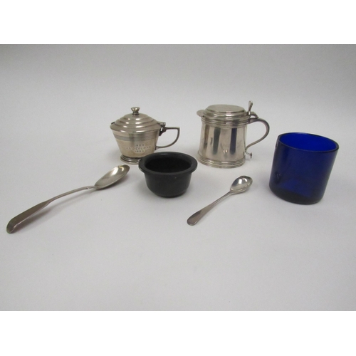 5032 - An Asprey & Co Ltd., silver mustard of plain form with blue glass liner (chipped) and associated sil... 