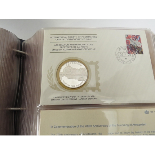 5034 - An album of International Society of Postmasters Official Commemorative Issue first day covers and s... 