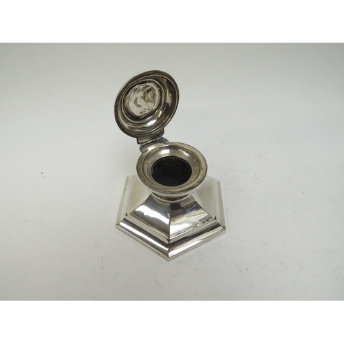 5039 - A silver capstan inkwell (lacking liner), dents to top, weighted base, 10cm long, date letter rubbed