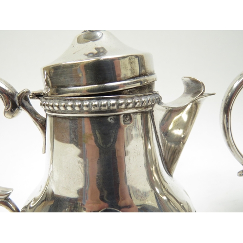 5041 - A Portuguese silver lidded coffee canister and pot with melon fluted detail, 16cm tall, 593g, missha... 