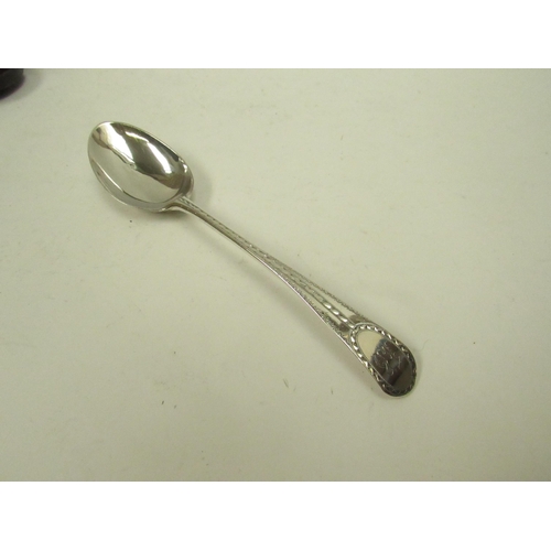 5068 - A silver spoon with bright cut detail marks indistinguishable in Mappin & Webb case, 24g