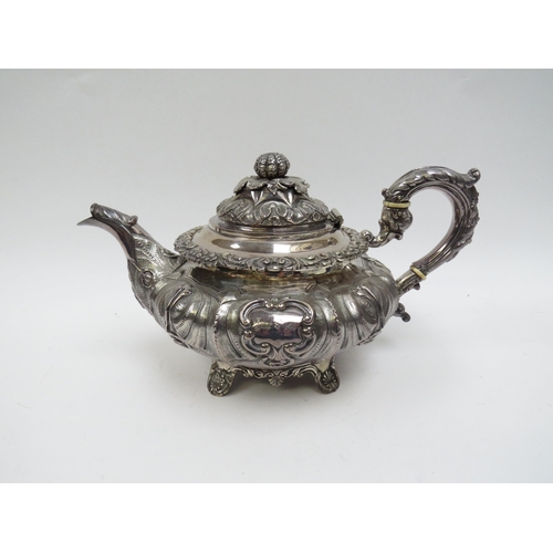 5098 - A Smith & Gamble silver teapot, all over foliate relief, Dublin 1832, inscribed cartouches, ivory in... 