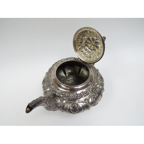 5098 - A Smith & Gamble silver teapot, all over foliate relief, Dublin 1832, inscribed cartouches, ivory in... 