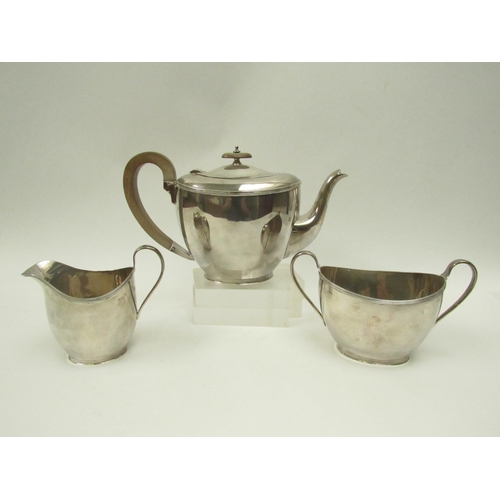 5102 - A Cooper Brothers & Sons Ltd., silver three piece teaset with treen handle and knop, Sheffield 1930,... 