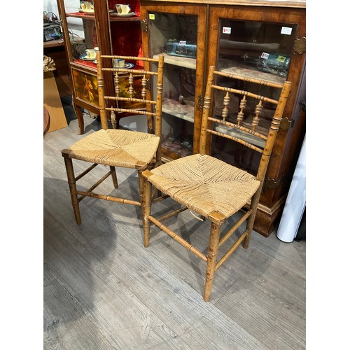 5523 - A set of four Regency bamboo effect chairs, turned spindle back supports, seagrass seats, one spindl... 