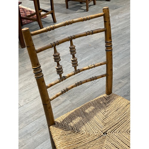 5523 - A set of four Regency bamboo effect chairs, turned spindle back supports, seagrass seats, one spindl... 